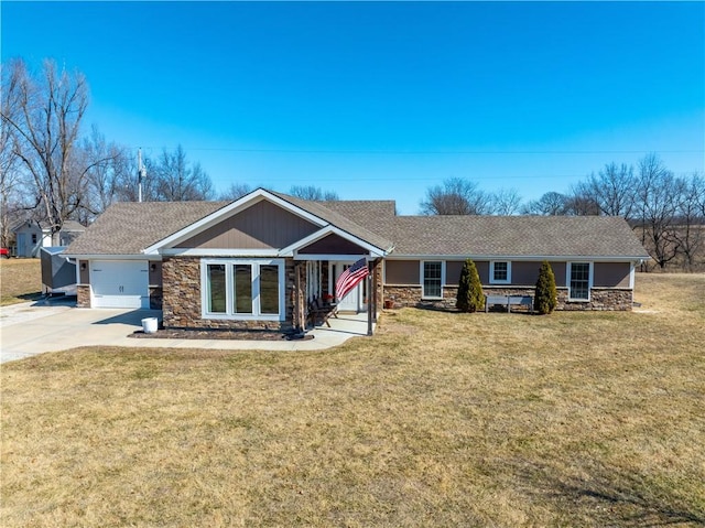 ranch-style house featuring stone siding, a front lawn, an attached garage, and driveway