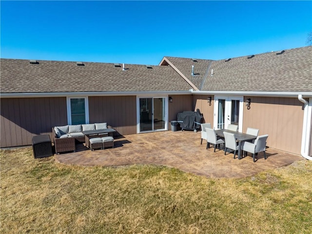 rear view of property featuring a lawn, roof with shingles, french doors, a patio area, and an outdoor living space