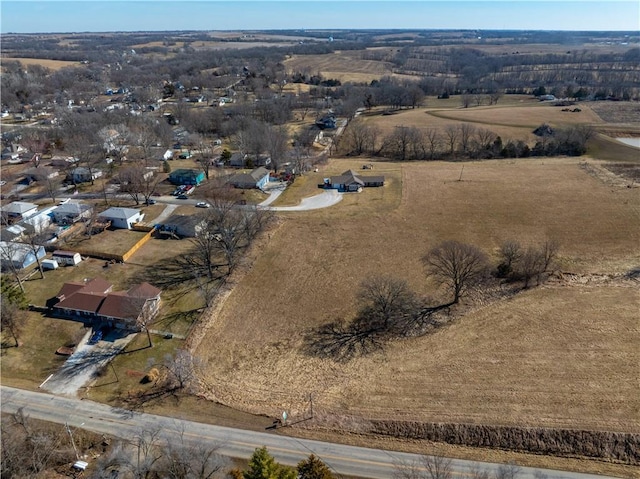 birds eye view of property with a rural view