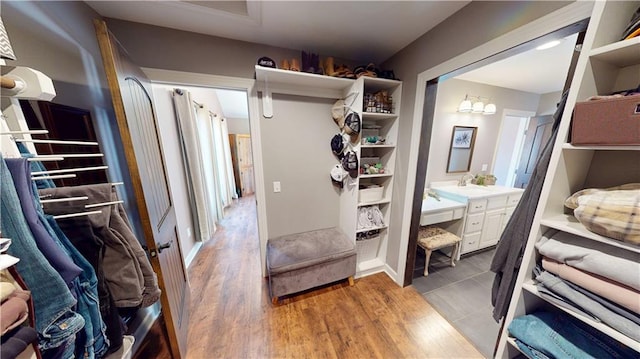 spacious closet featuring light wood-type flooring