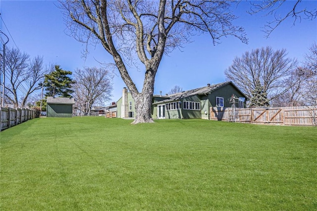 view of yard with a fenced backyard