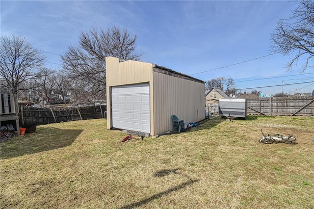 view of outdoor structure with an outbuilding and a fenced backyard