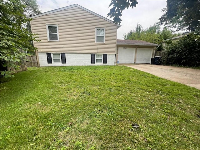 split level home featuring brick siding, concrete driveway, a front yard, fence, and a garage