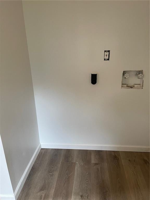 interior space featuring wood finished floors and baseboards