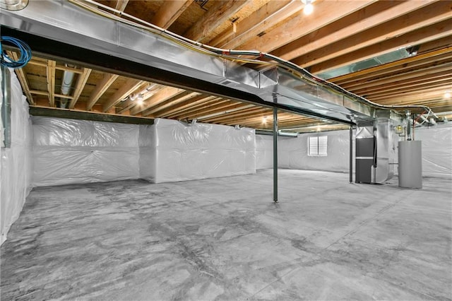 11019 N Bristol Ave, Kansas City, MO 64156 - basement featuring gas water heater and heating unit