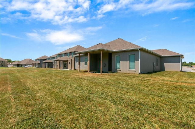 11019 N Bristol Ave, Kansas City, MO 64156 - rear view of house featuring a yard