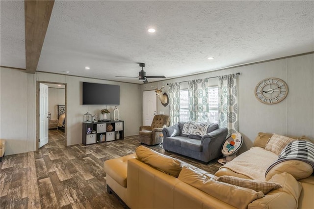 living area with a textured ceiling, ceiling fan, wood finished floors, and recessed lighting