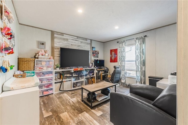 living area featuring a textured ceiling and wood finished floors