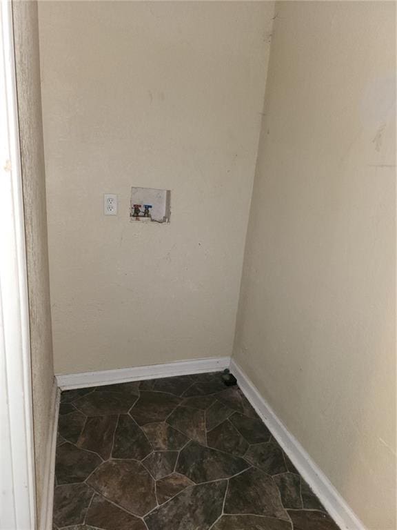 laundry area with hookup for a washing machine, laundry area, and baseboards