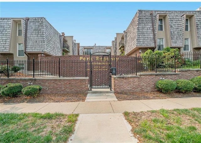 view of gate featuring a fenced front yard