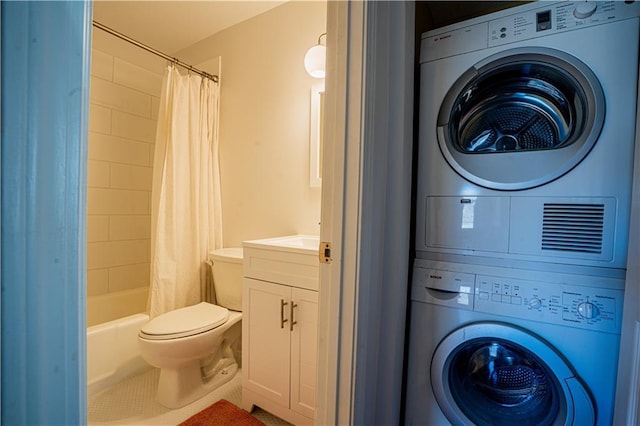 bathroom featuring tile patterned flooring, toilet, stacked washer / dryer, vanity, and shower / bath combination with curtain