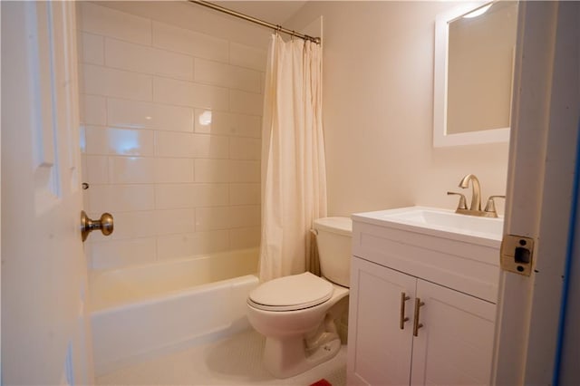 full bathroom featuring shower / bath combo, vanity, and toilet