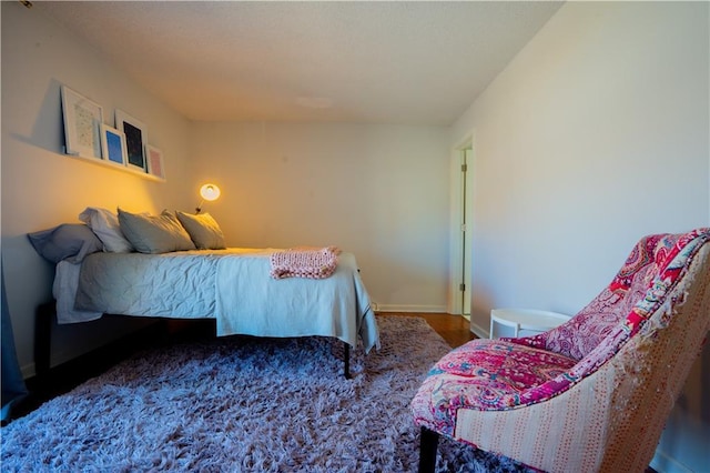 bedroom featuring baseboards