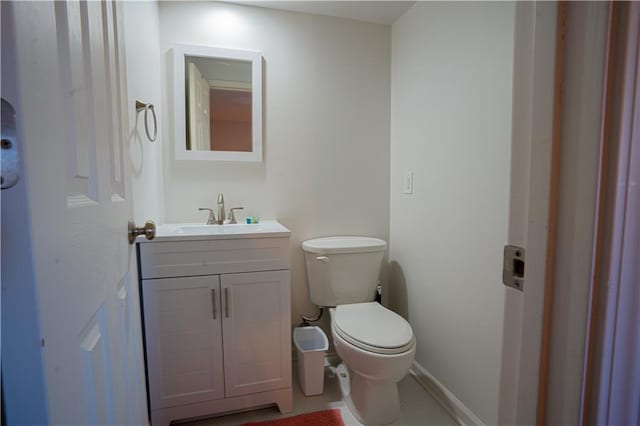 half bath with vanity and toilet