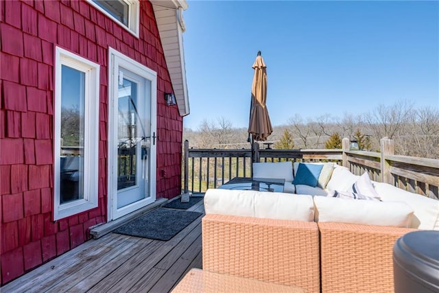 wooden deck with an outdoor hangout area