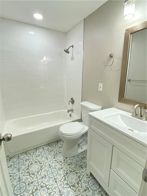 full bath featuring bathtub / shower combination, vanity, toilet, and tile patterned floors