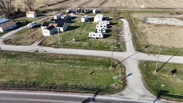 birds eye view of property with a rural view