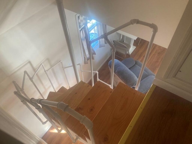 stairs with wood finished floors
