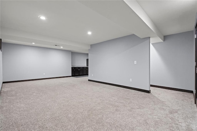 finished basement featuring carpet floors, recessed lighting, and baseboards