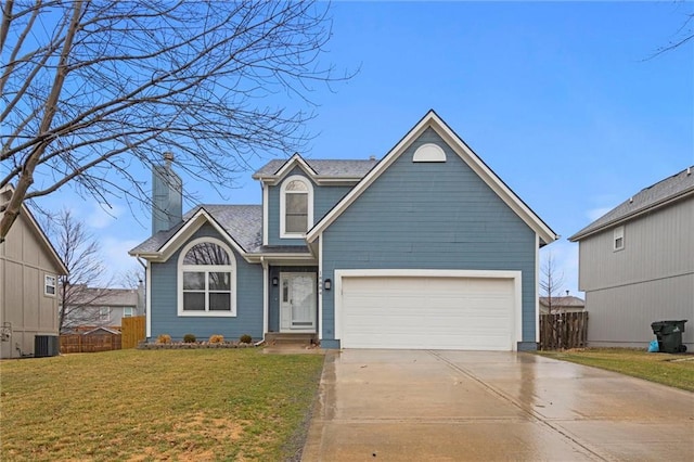 view of front facade with driveway, a front lawn, an attached garage, and fence