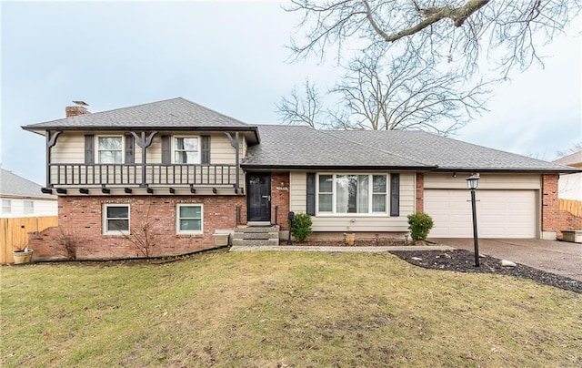 split level home featuring brick siding, driveway, a front lawn, and a chimney