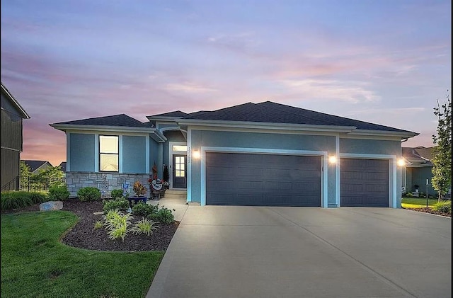 view of front of house with a garage, stone siding, concrete driveway, and stucco siding