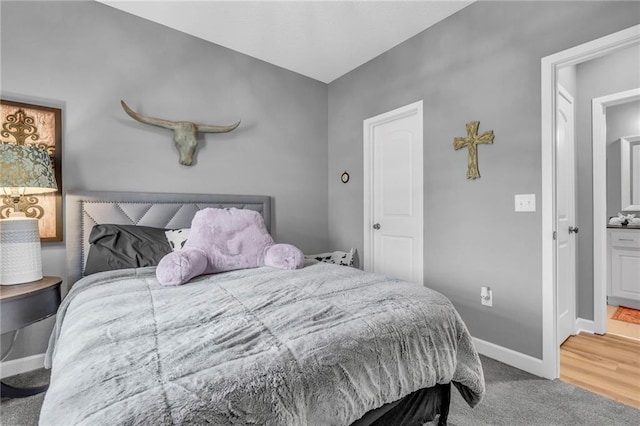 carpeted bedroom with baseboards