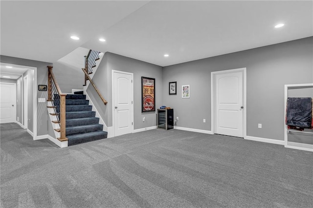 unfurnished living room with stairs, carpet floors, baseboards, and recessed lighting