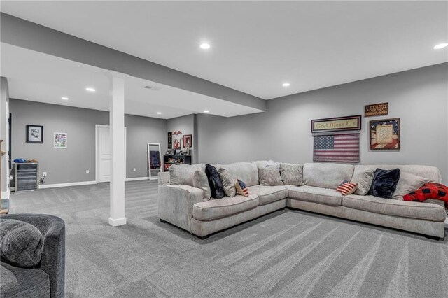 carpeted living room with recessed lighting, visible vents, and baseboards