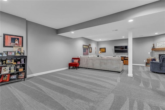 carpeted living room with visible vents, a fireplace, baseboards, and recessed lighting