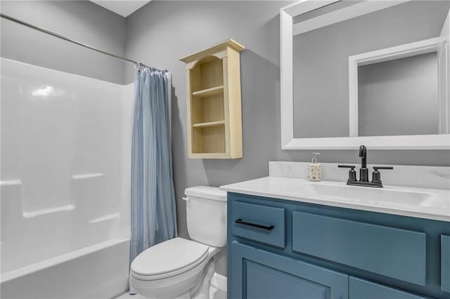 bathroom featuring shower / tub combo, vanity, and toilet