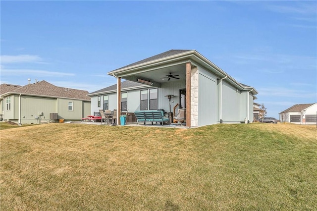 back of property featuring ceiling fan, a patio, a lawn, and cooling unit