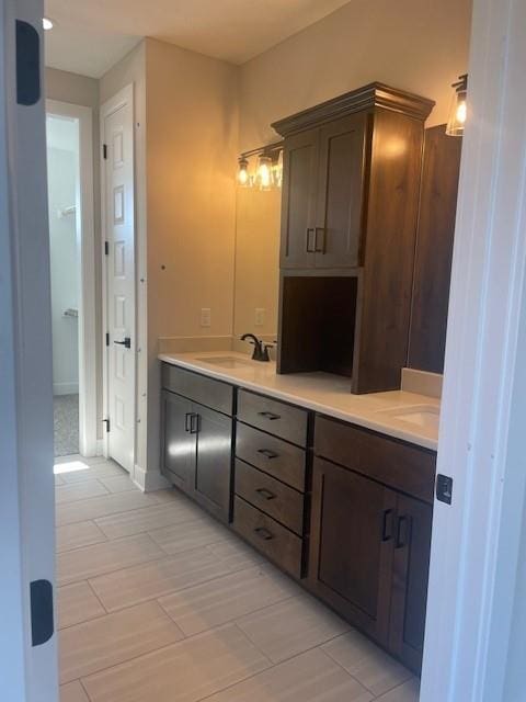 full bathroom featuring a sink and double vanity