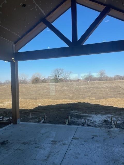 view of yard with a patio and a rural view