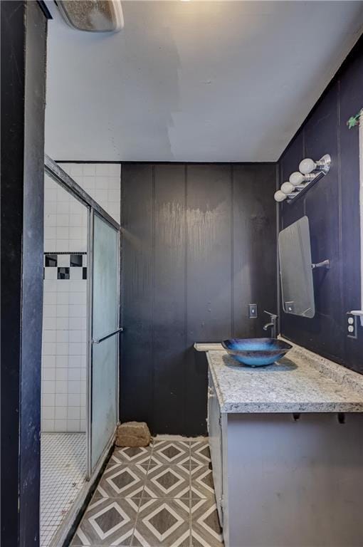 full bathroom featuring a stall shower and vanity