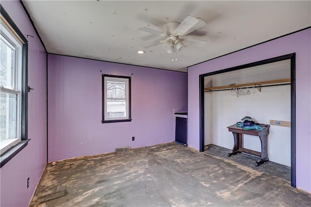 unfurnished bedroom with ceiling fan, visible vents, and a closet