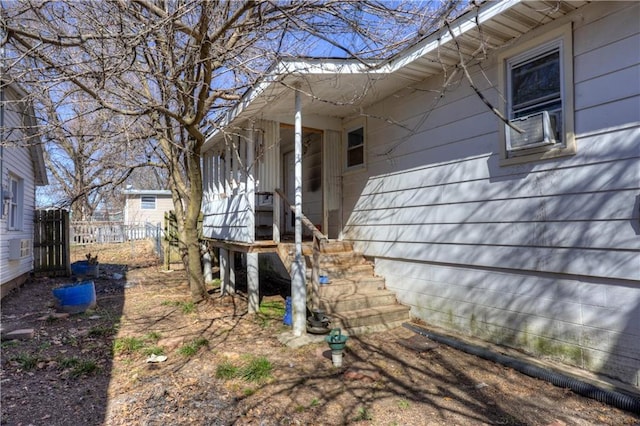 view of side of home with fence