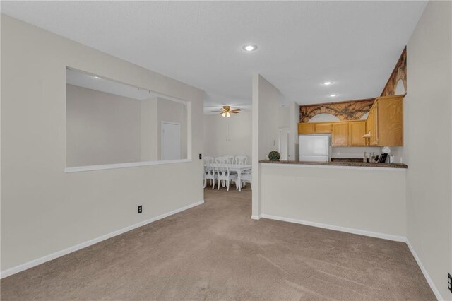 unfurnished living room with recessed lighting, baseboards, carpet floors, and ceiling fan