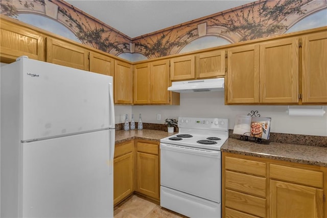 kitchen with under cabinet range hood, white appliances, and wallpapered walls