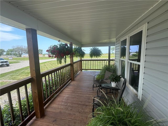 wooden terrace featuring a porch