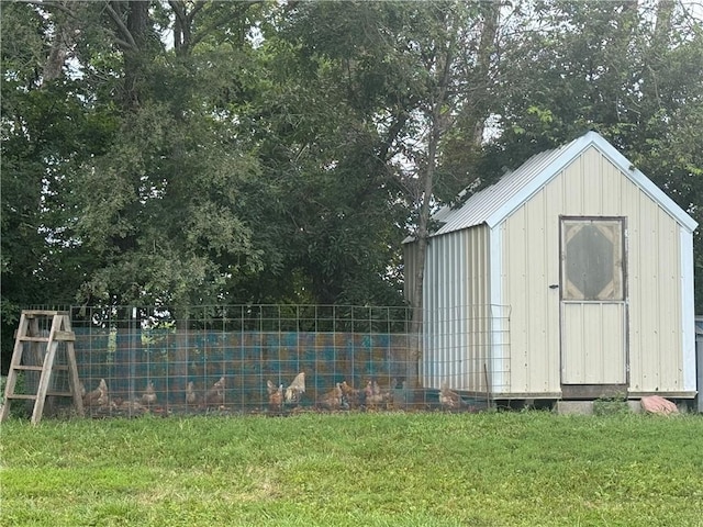 view of shed featuring fence