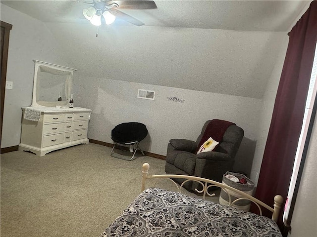 living area featuring vaulted ceiling, carpet, baseboards, and ceiling fan