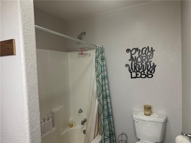 full bathroom with toilet and shower / tub combo