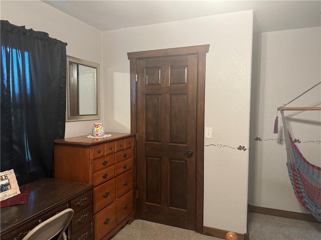 bedroom featuring baseboards