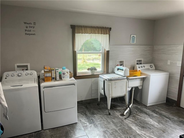 washroom featuring separate washer and dryer and laundry area