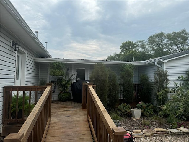 wooden terrace featuring grilling area