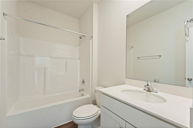 full bath with toilet, shower / bathtub combination, and vanity