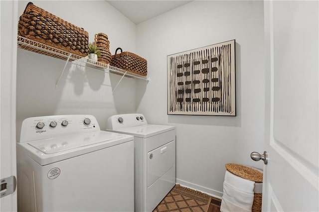 7802 NE 107th Ter, Kansas City, MO 64157 - laundry area featuring washing machine and dryer and baseboards