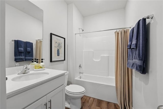 7802 NE 107th Ter, Kansas City, MO 64157 - bathroom with wood finished floors, vanity, toilet, and shower / tub combo