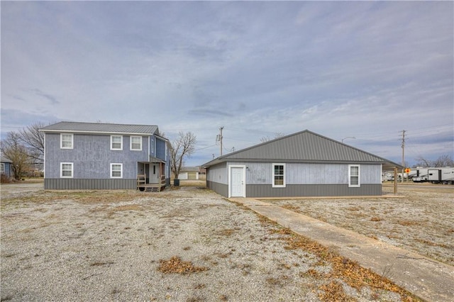 view of side of property with metal roof